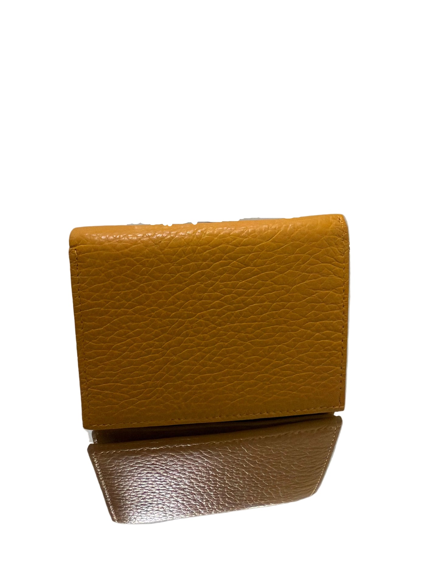 Brown leather wallet on a white surface