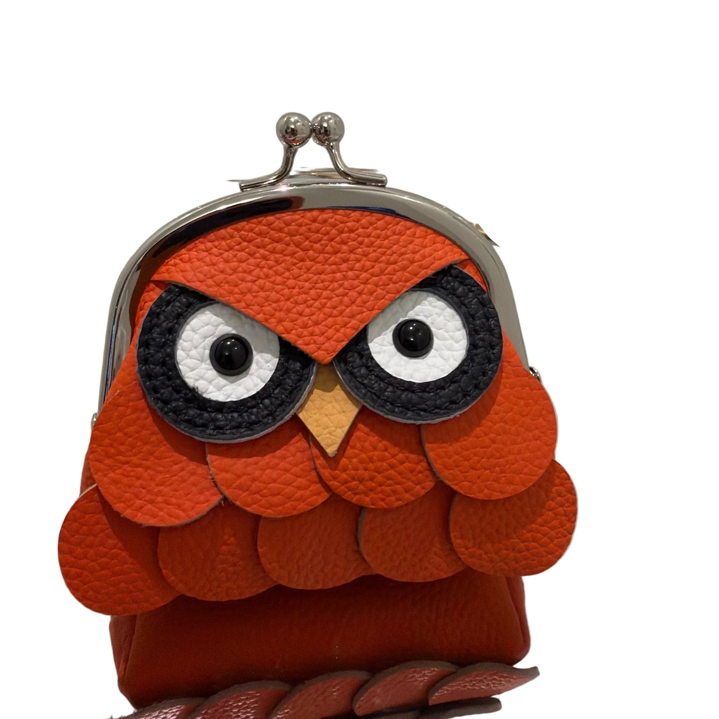Handbag with a unique design featuring orange, black, and white colors on a white background.