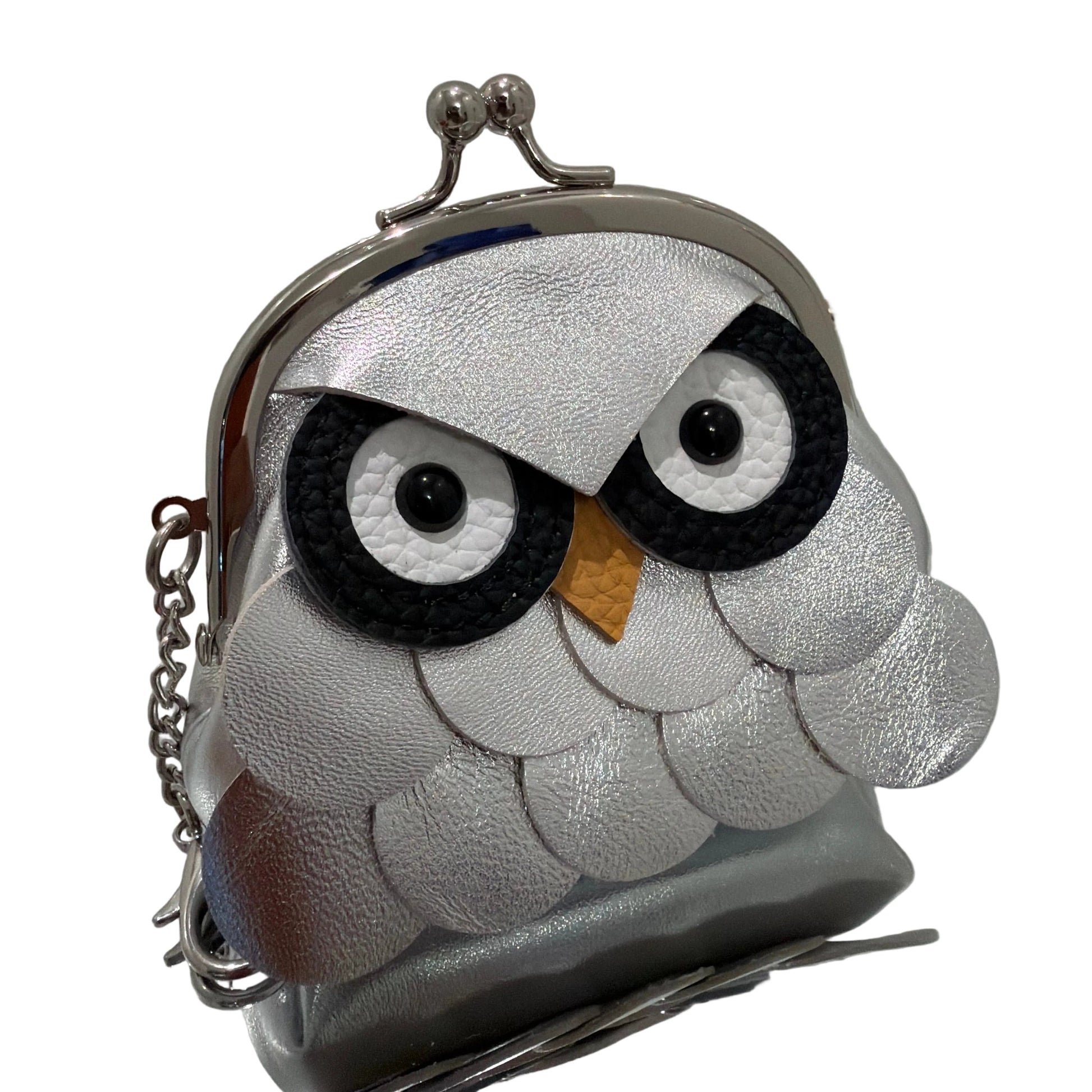 Silver clutch bag with owl design on a white background