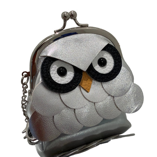 Silver clutch bag with owl design on a white background