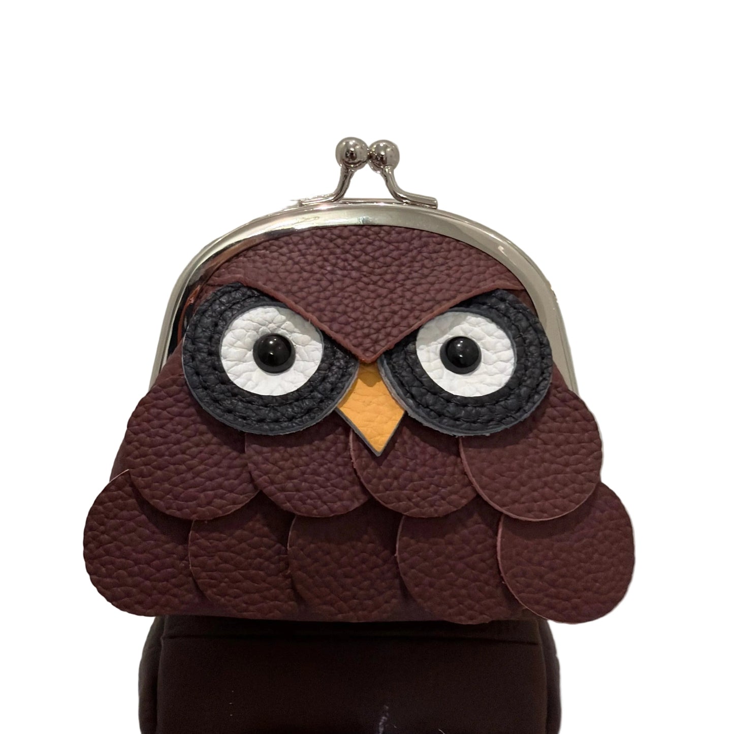 Brown owl-shaped pouch with a reflective surface