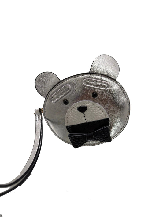 Metallic animal-shaped clips on a white background