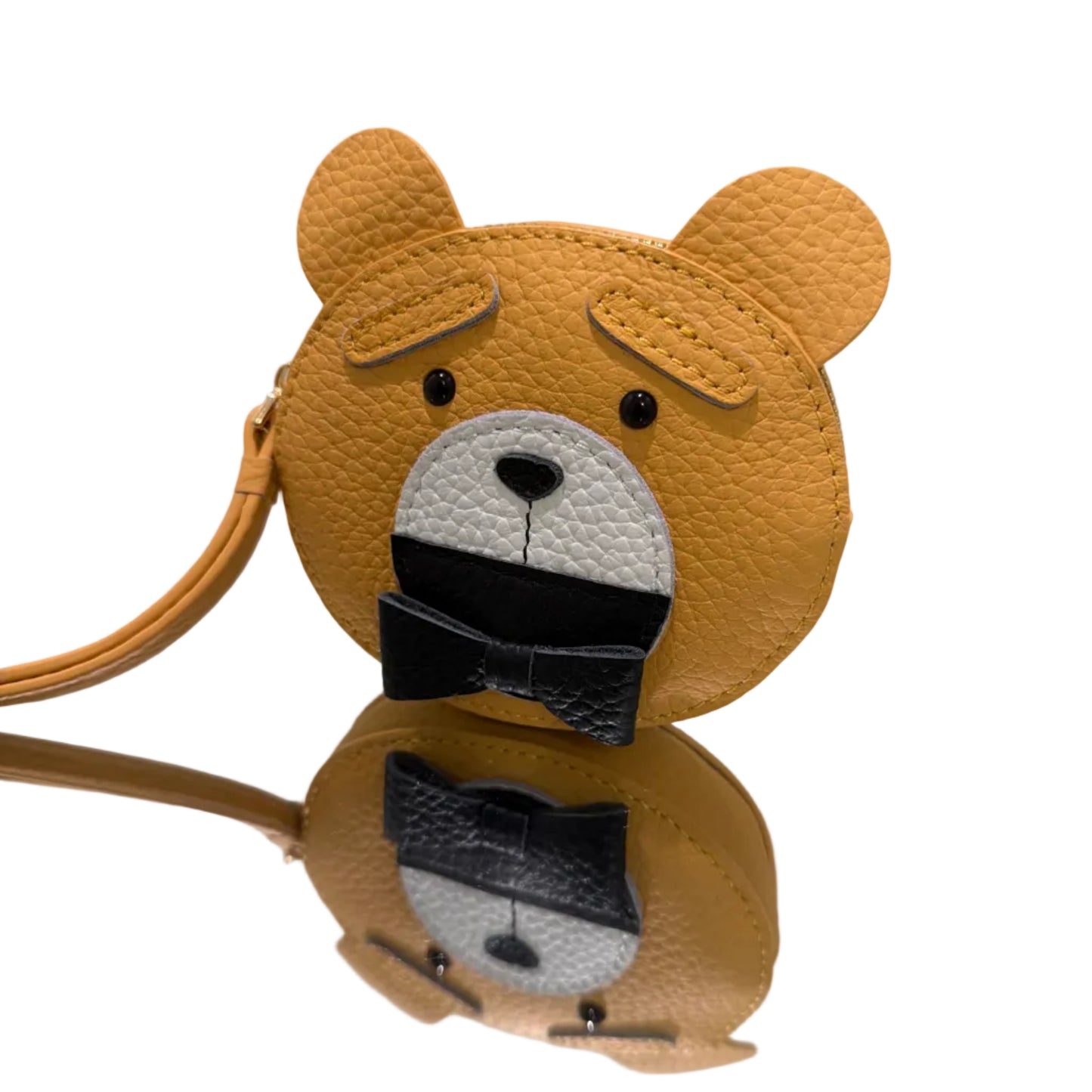 Brown bear-shaped headband with black bow on a white background