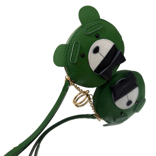 Green character-shaped keychain with a strap on a white background