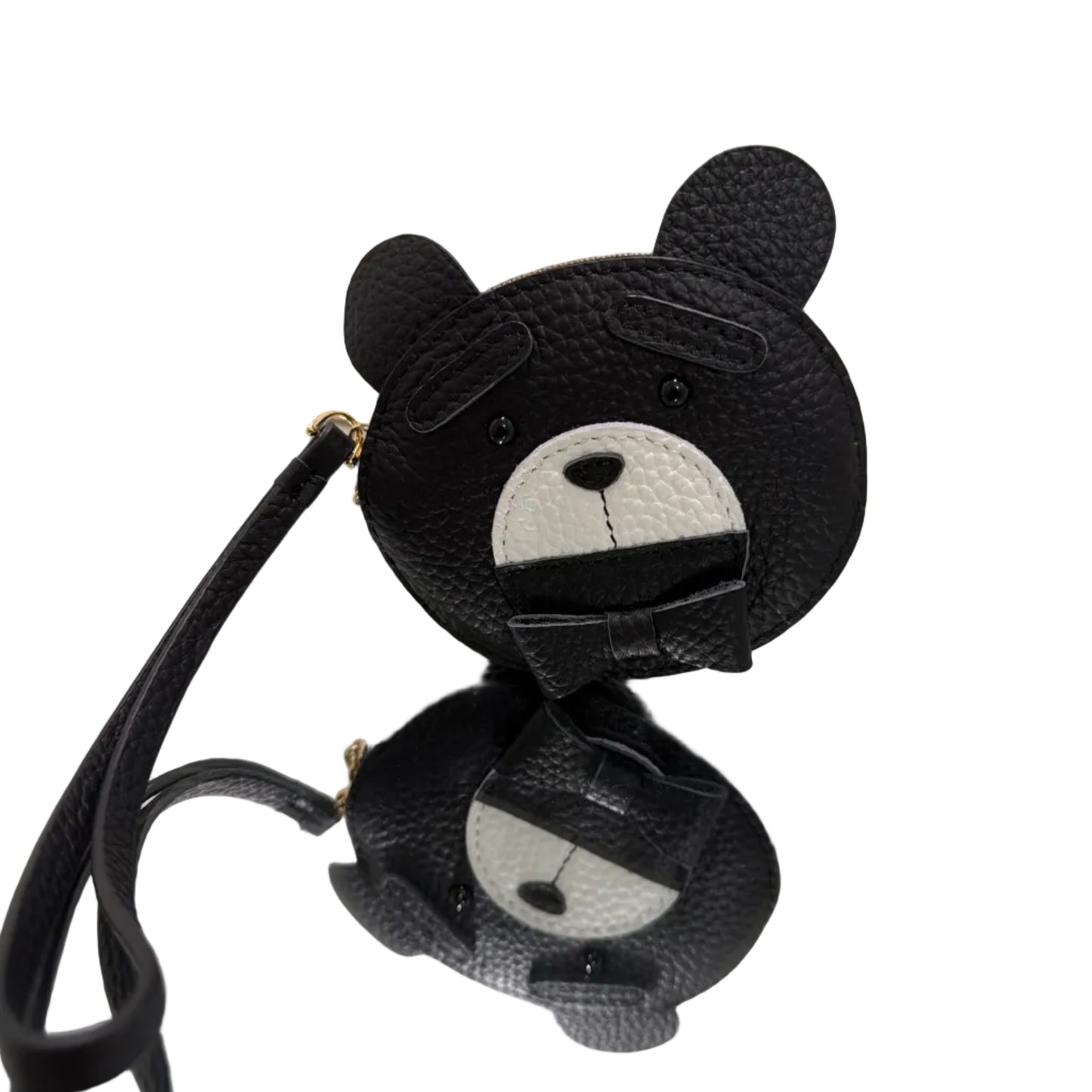 Black earbud covers with cartoon face design on a white background