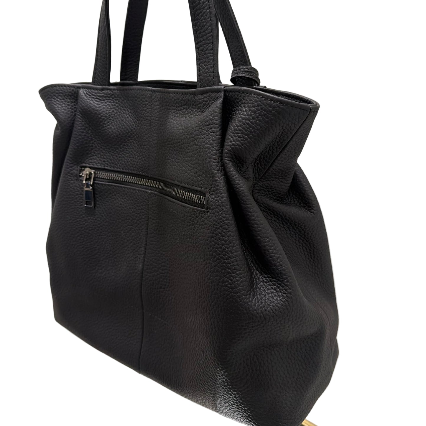 Black leather backpack on a white surface with a neutral background