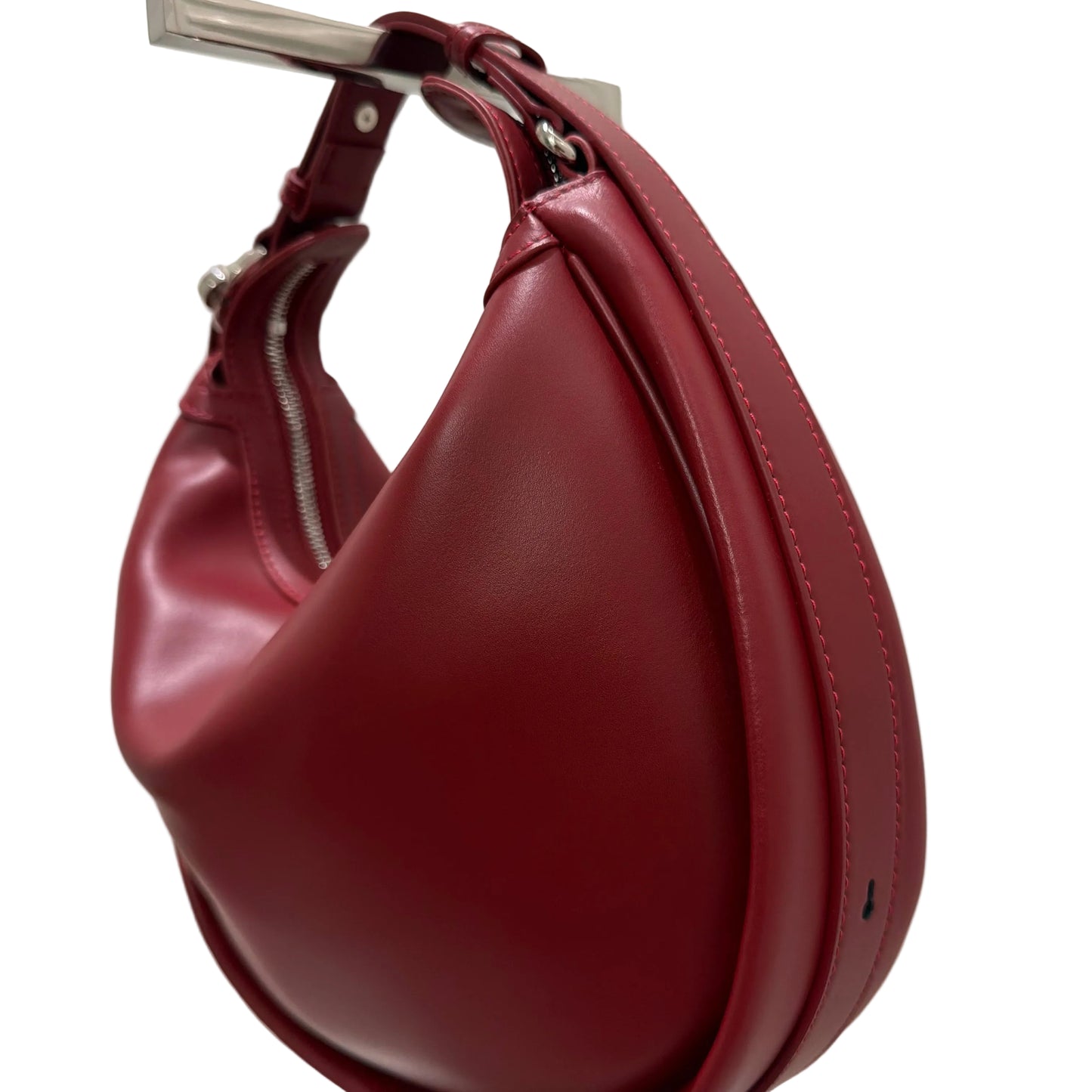 Maroon leather handbag on a white background
