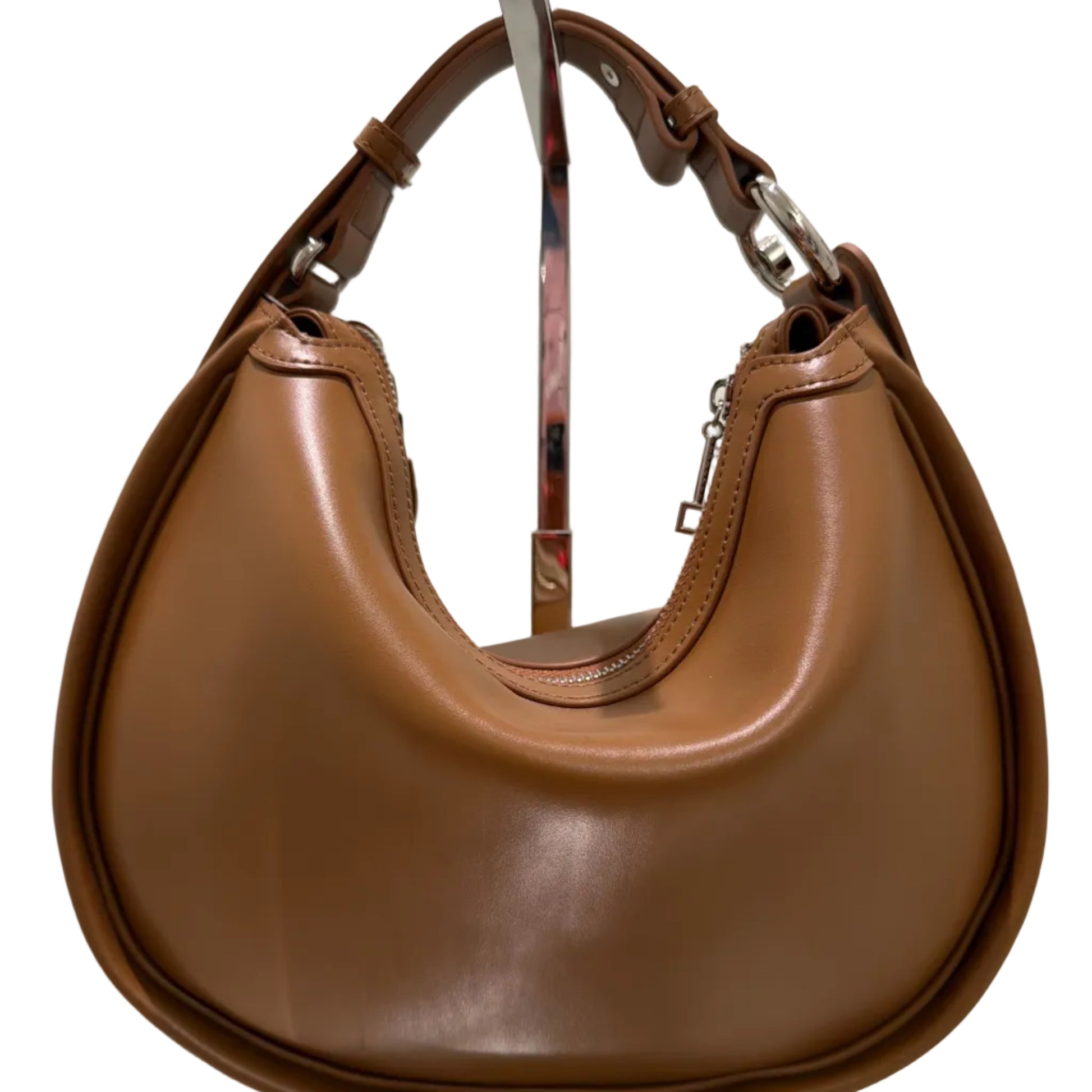 Brown leather saddle pad on a white background