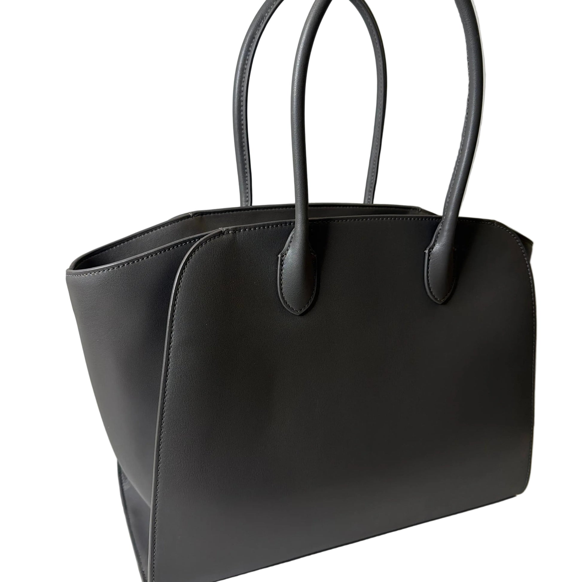 Black handbag on a light gray background