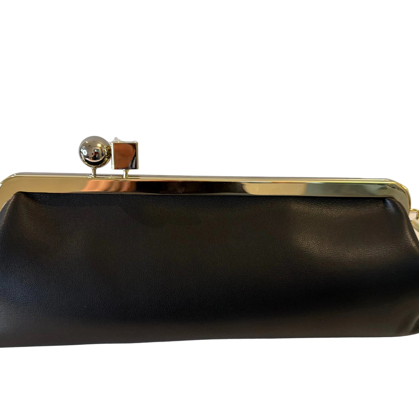 Black clutch bag with gold frame on a white surface