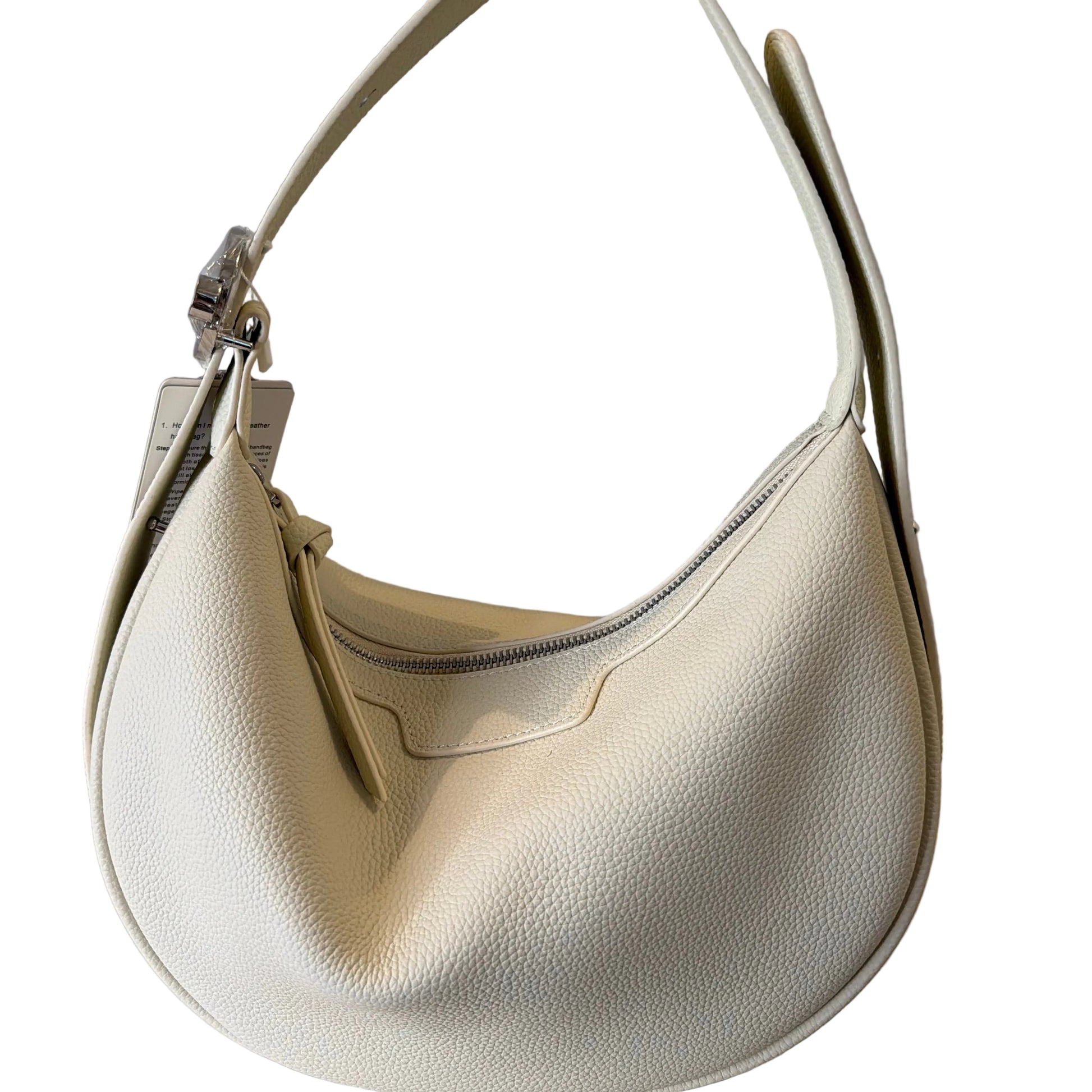 Beige handbag on a light gray background