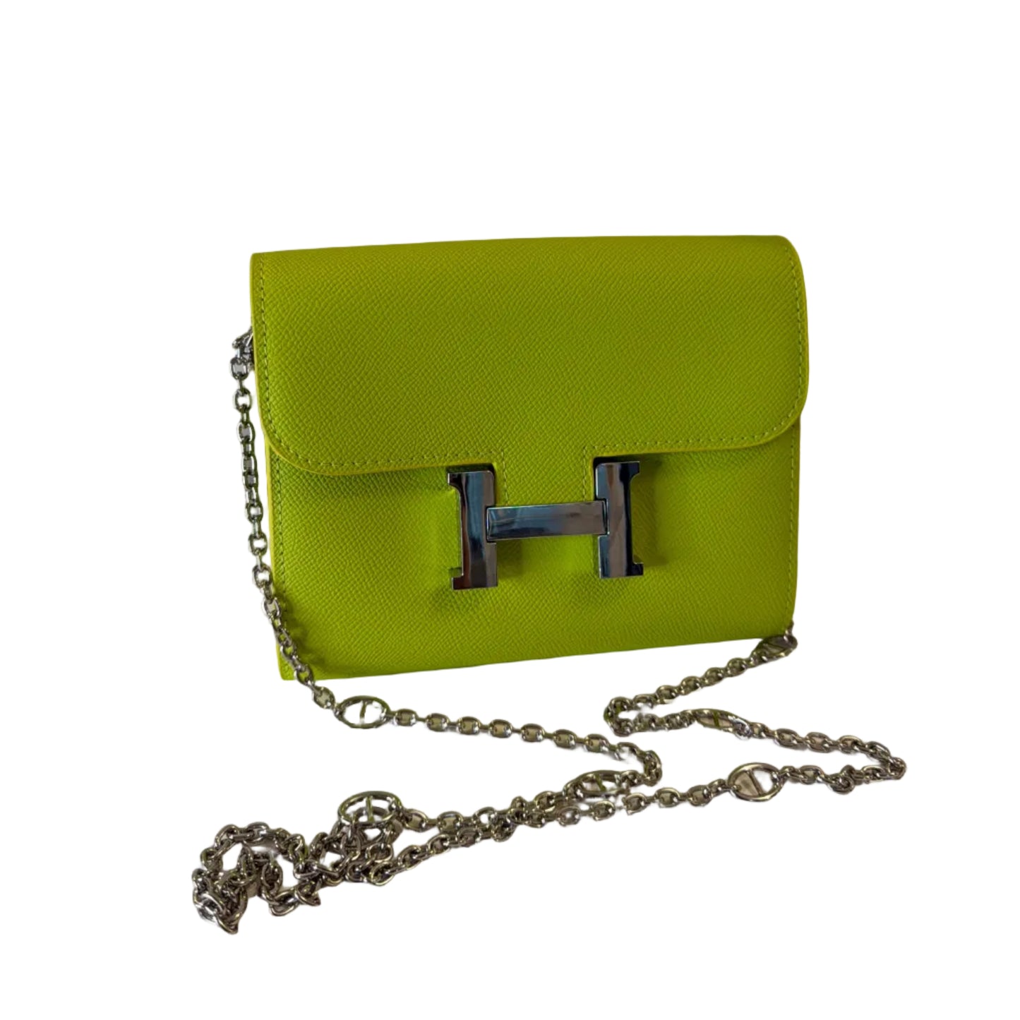 Green handbag with a silver chain on a white background