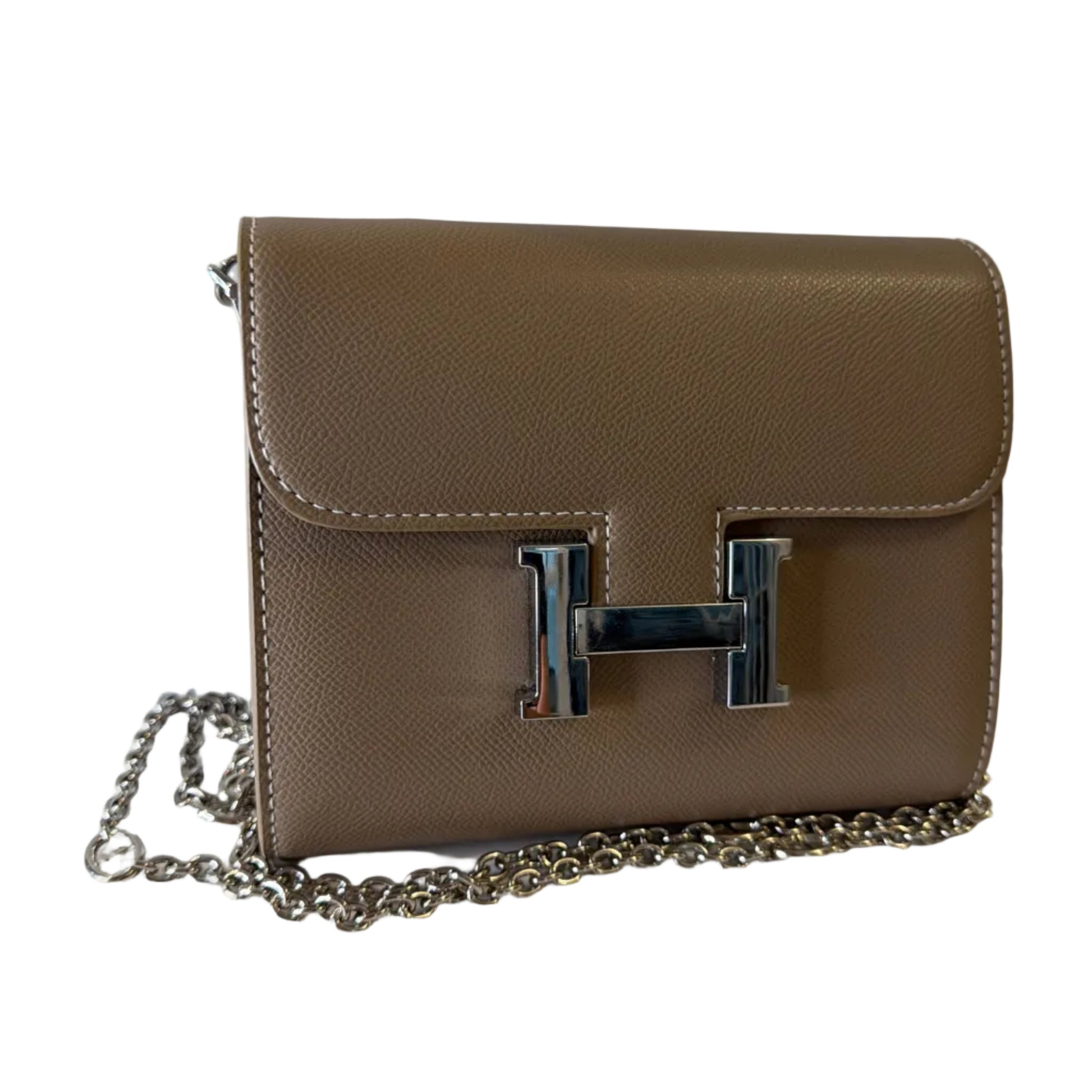 Beige handbag with a silver chain and logo on a white background