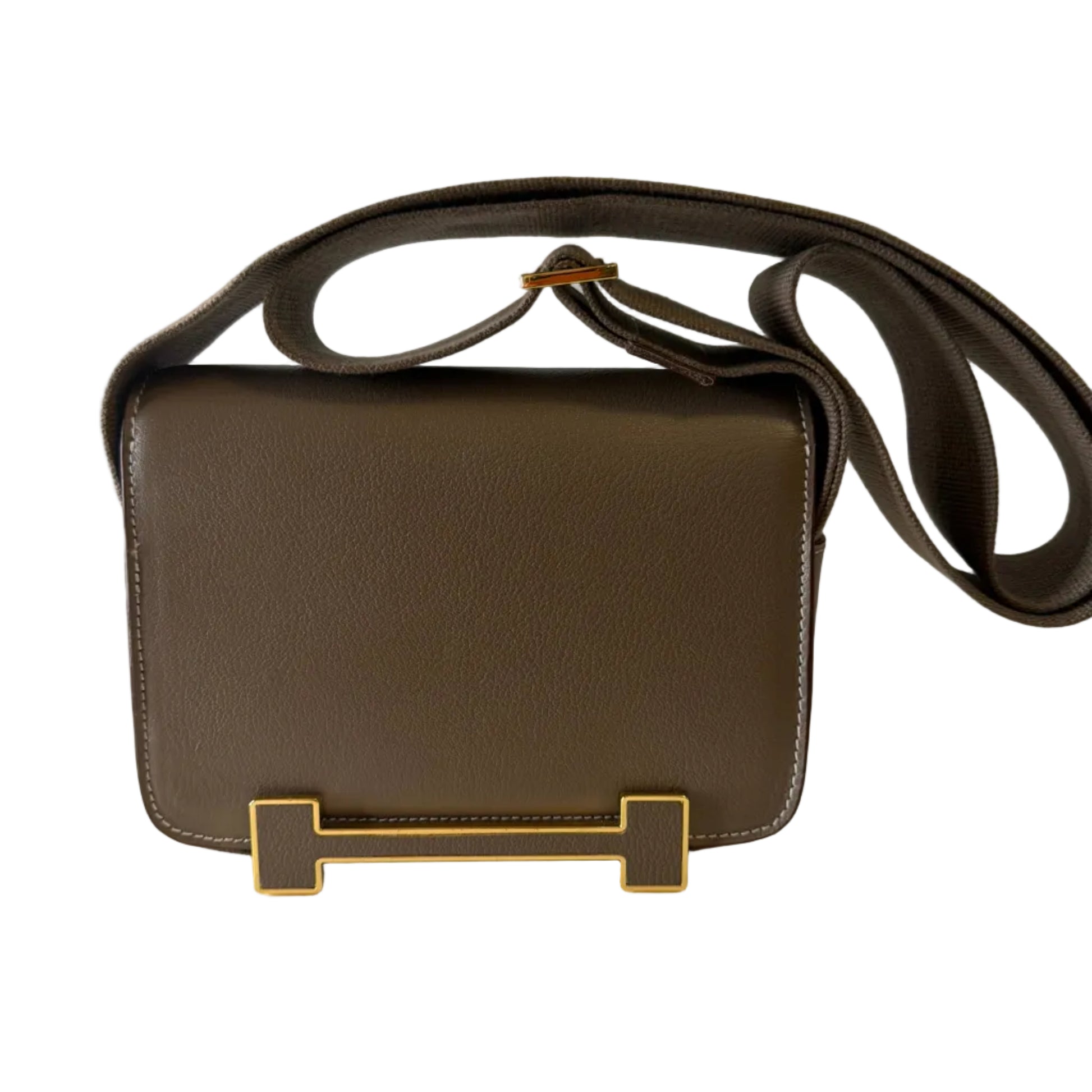 Brown leather bag with a gold 'H' logo on a white background