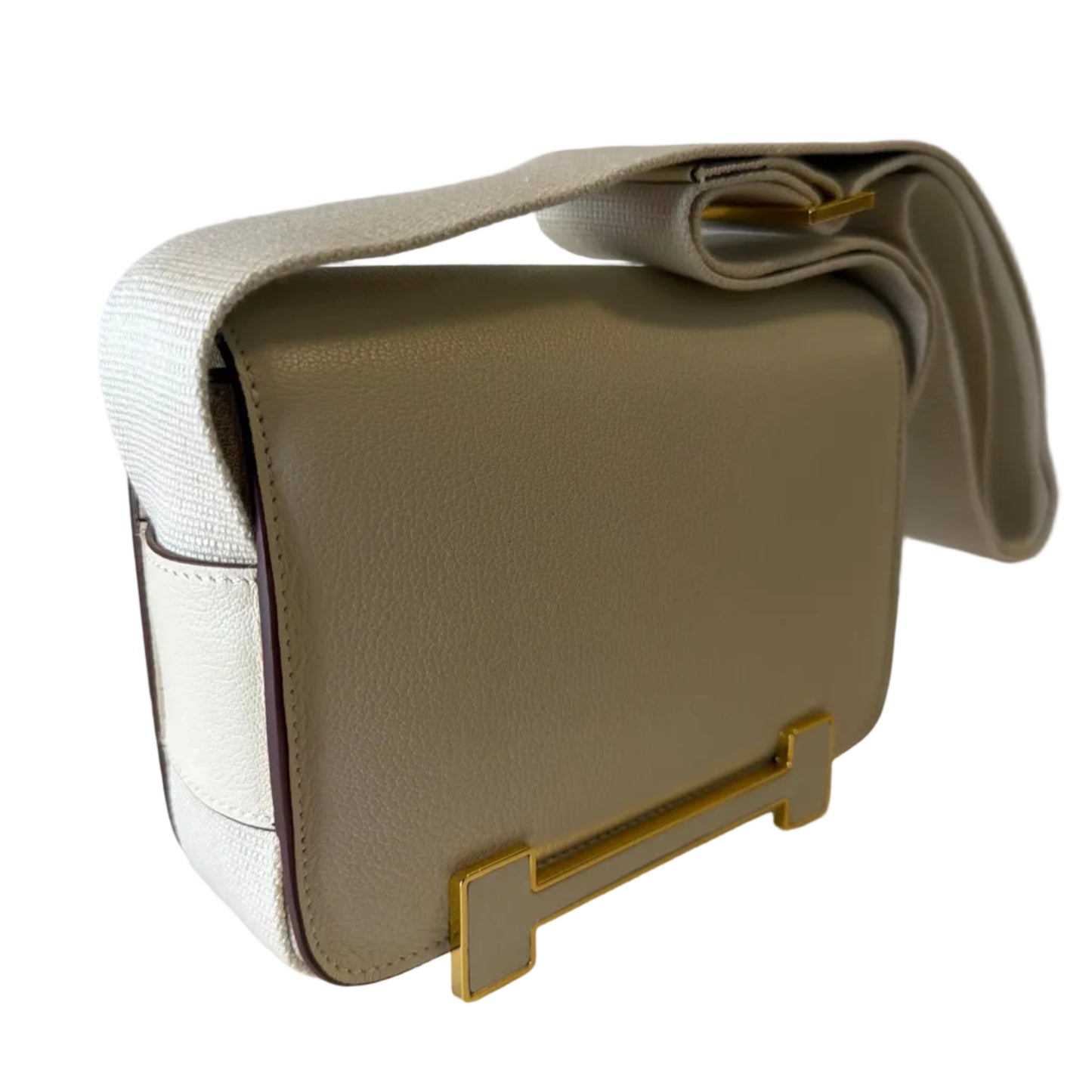 Beige handbag with a gold clasp on a light gray background