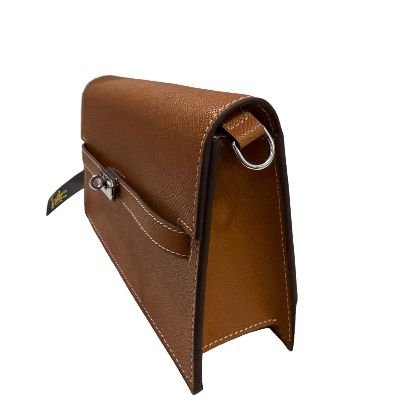 Brown leather car phone holder attached to a car's air vent.