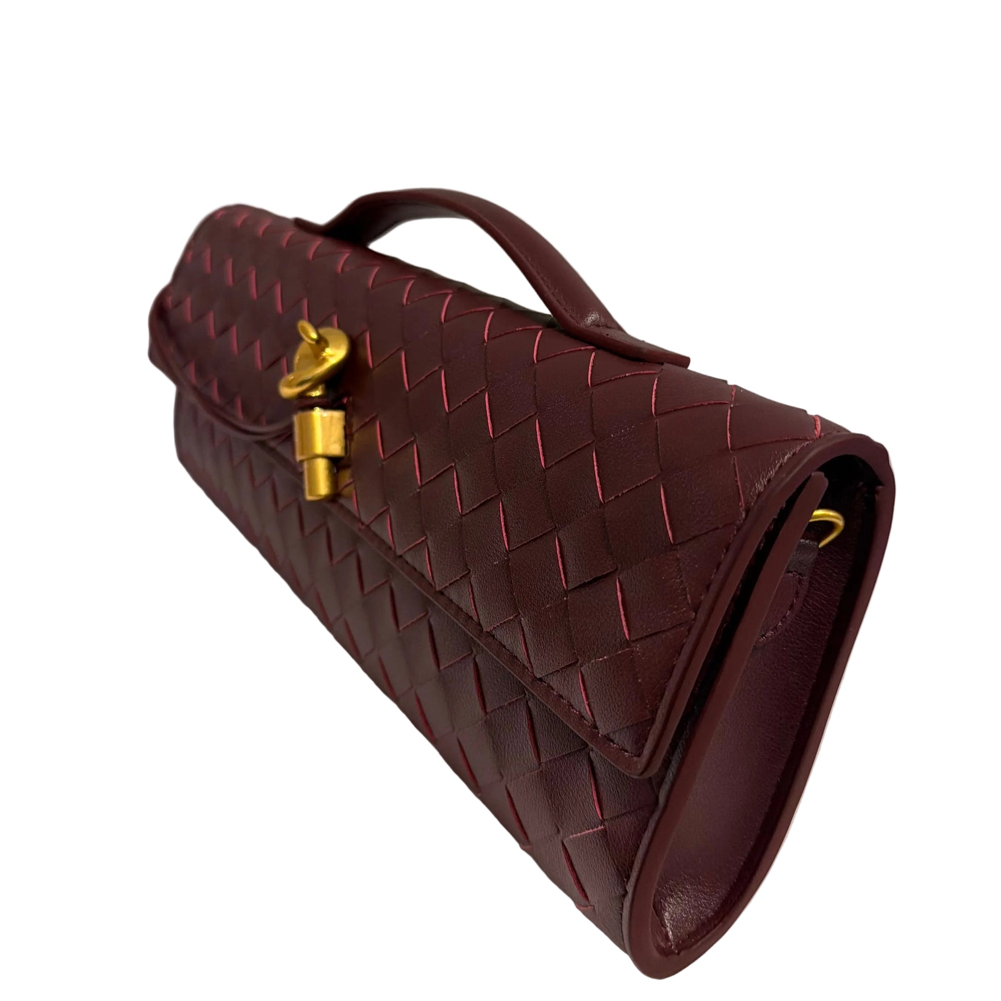 Maroon handbag with gold clasp on a light gray background