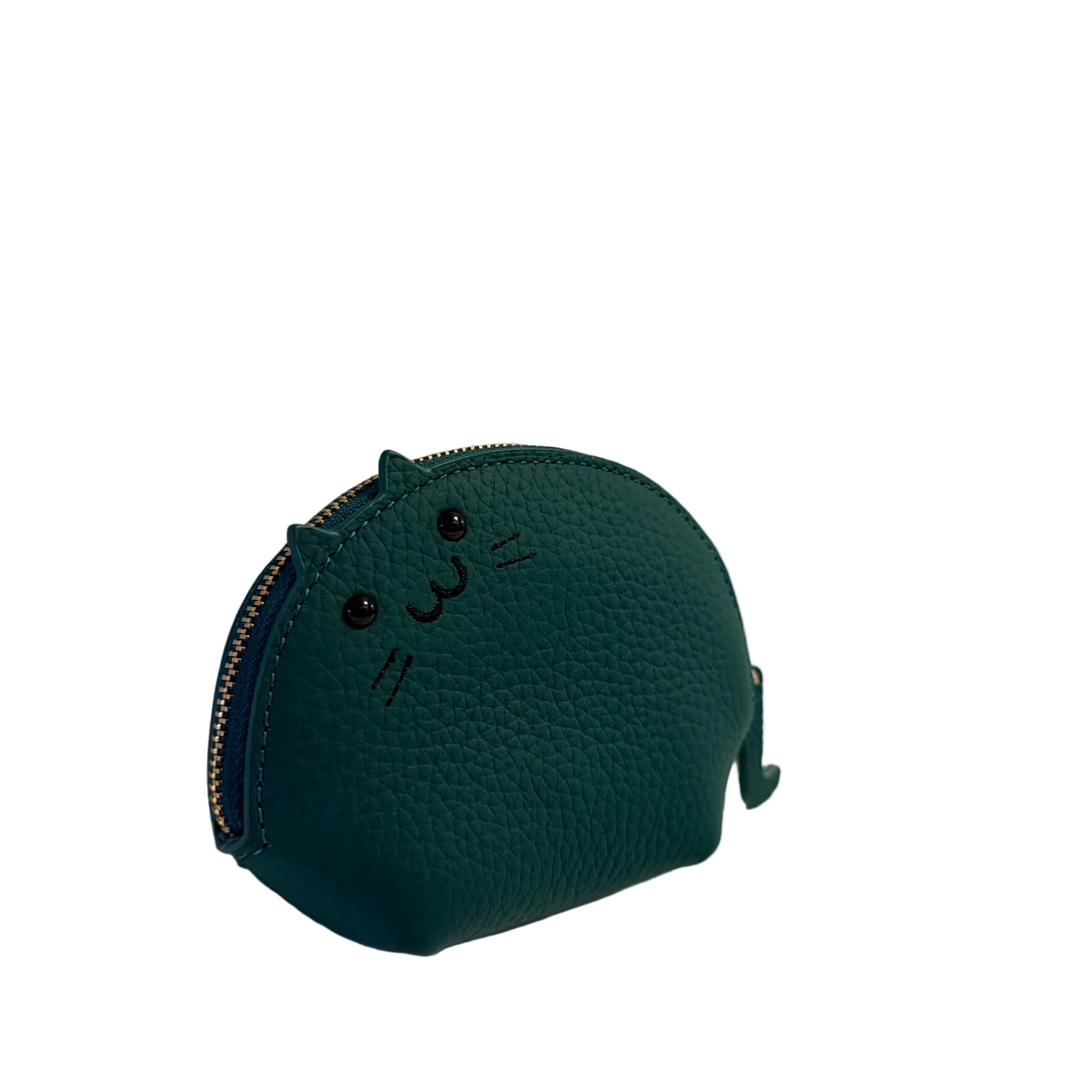 Green textured pouch with a face design on a light gray background