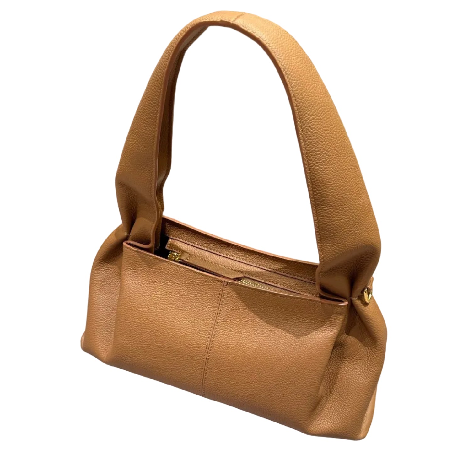 Brown handbag on a light gray surface with a blurred background