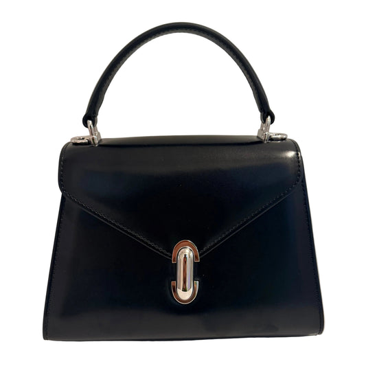 A black leather handbag with a structured top handle, a front flap, and a silver-tone metal clasp, photographed against a plain light gray background.
