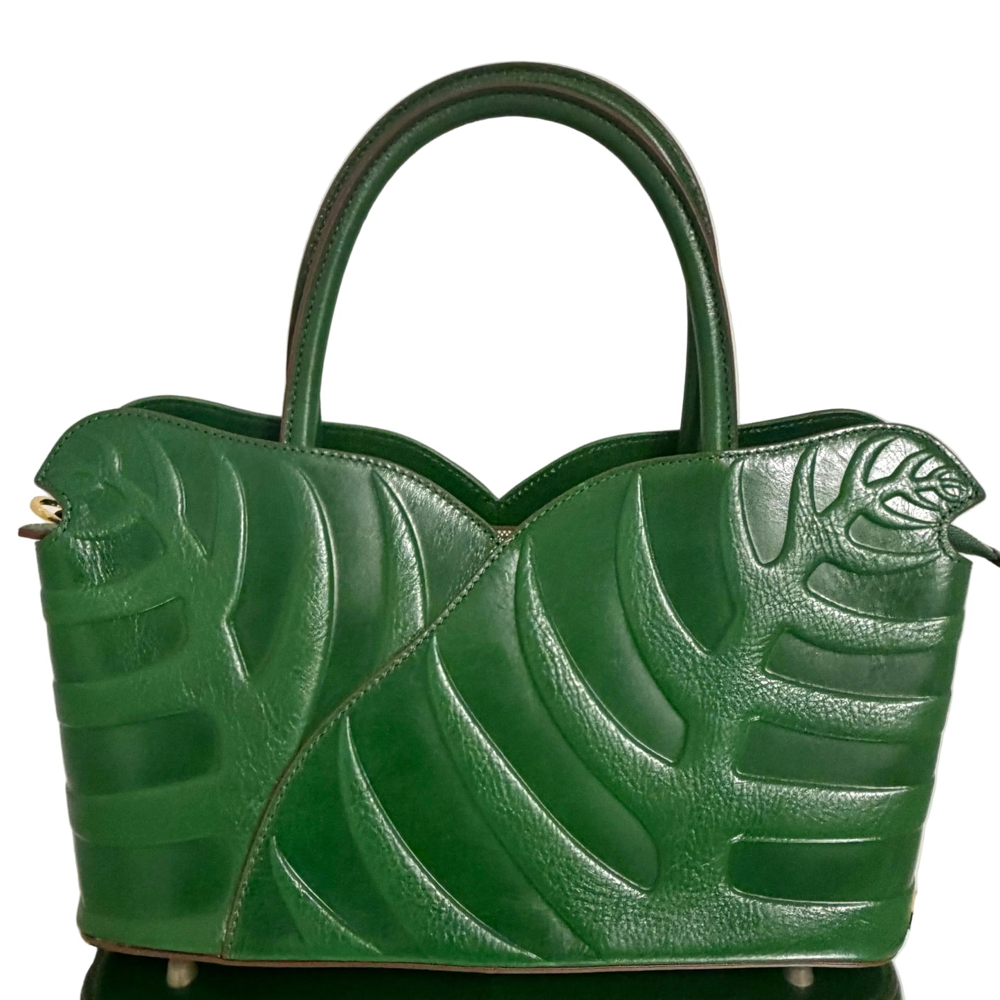 Green textured handbag on a white background