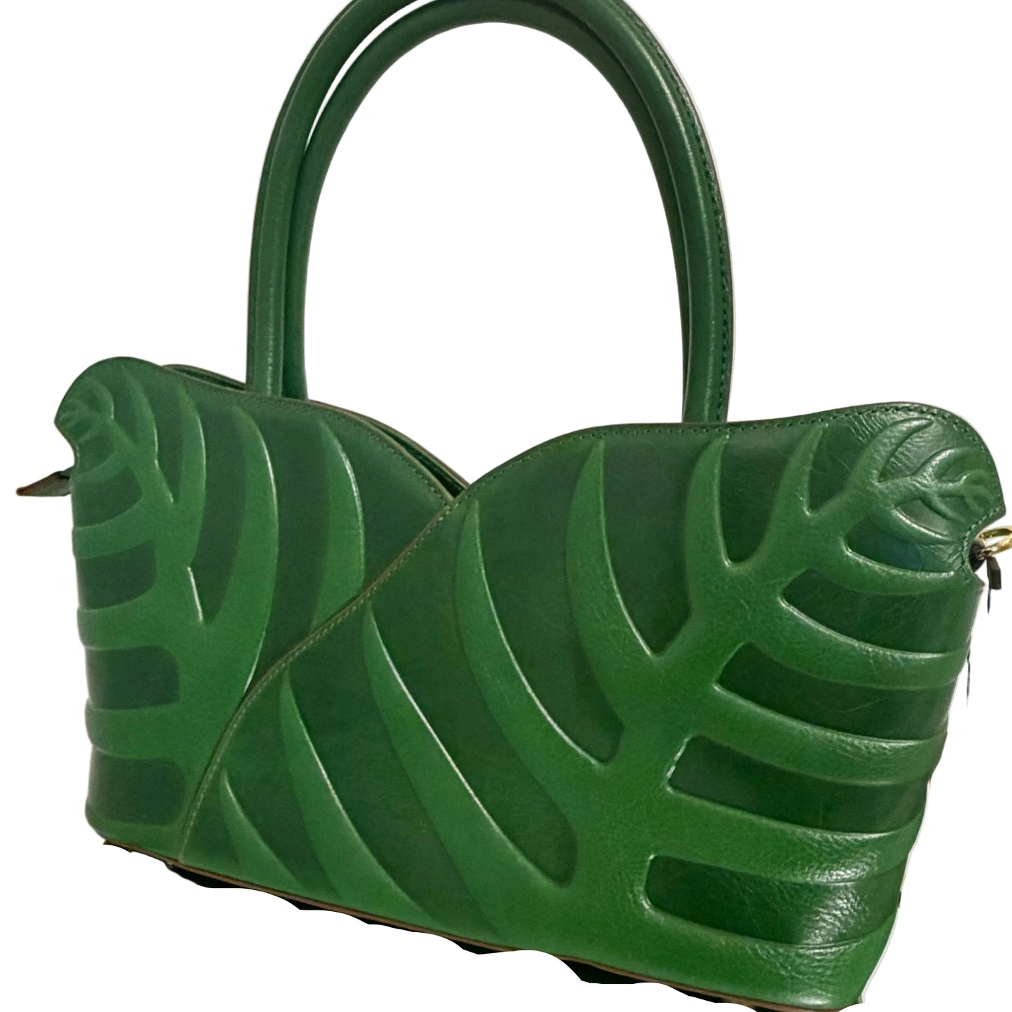 Green leaf-patterned shoes on a white background
