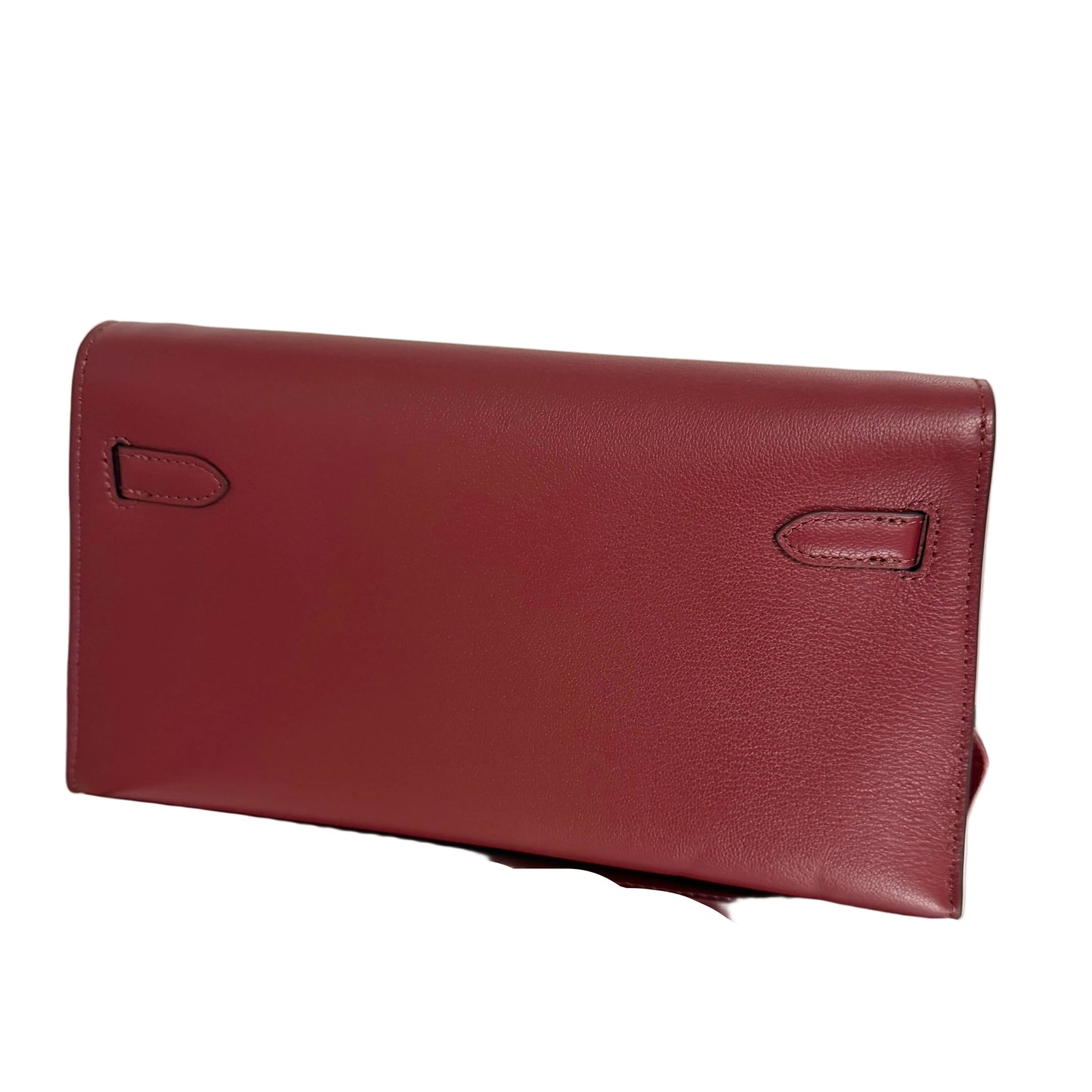 Two maroon leather wallets on a light beige background