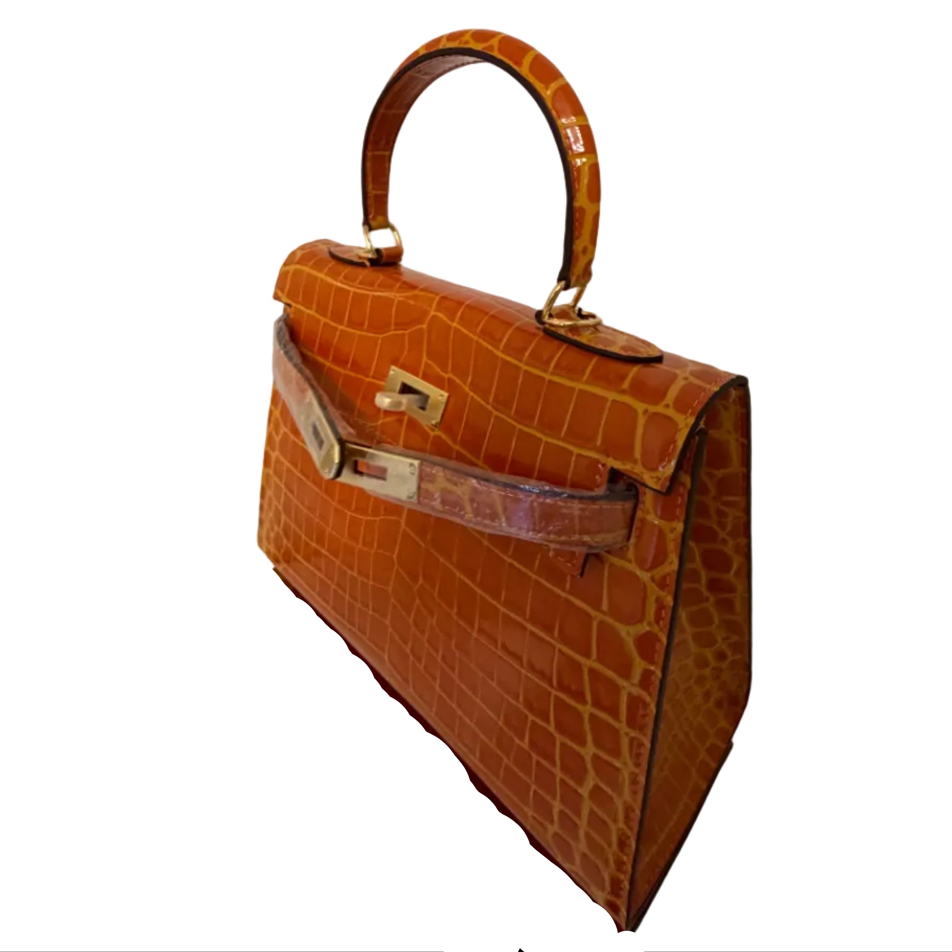 Brown crocodile skin handbag with gold hardware on a white background