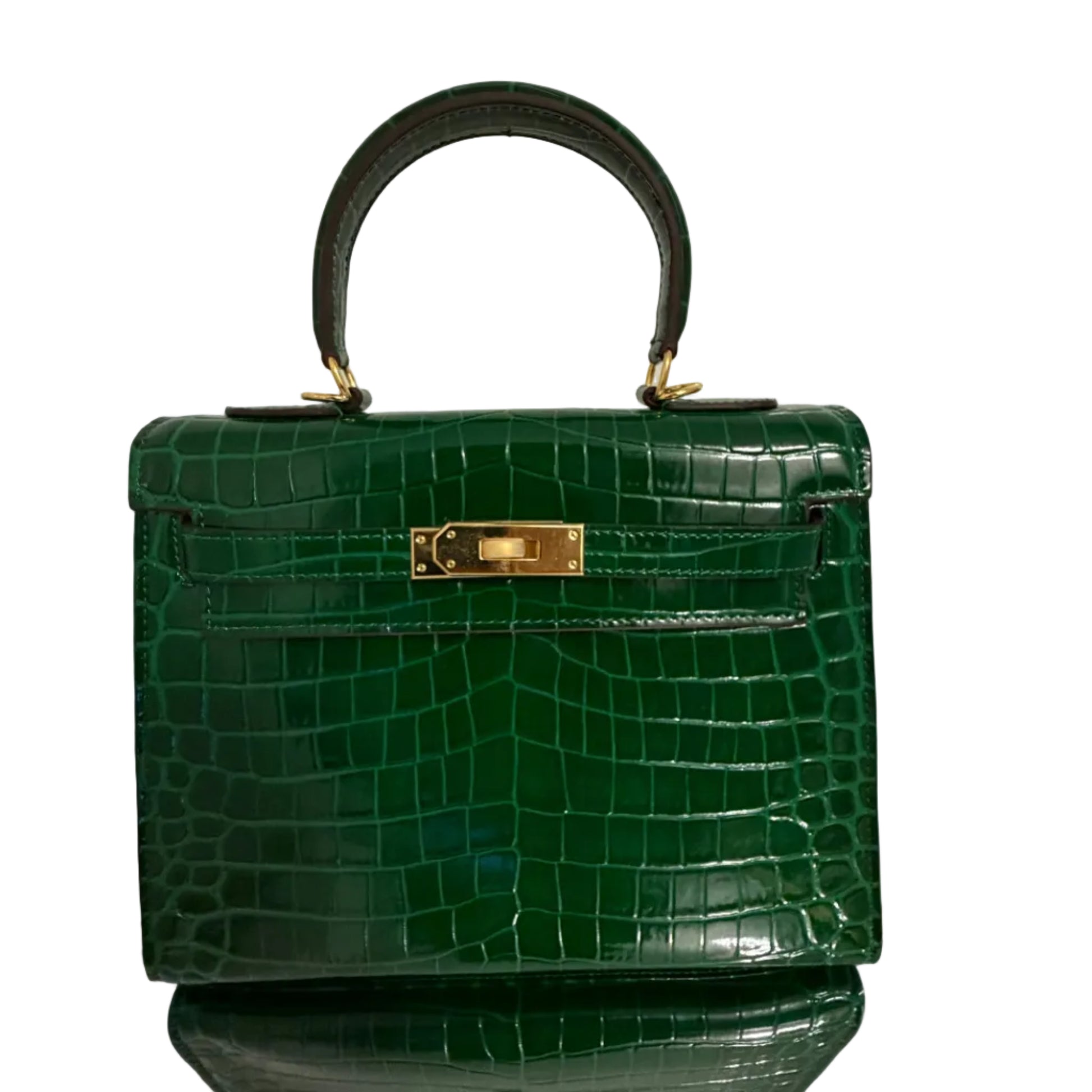 Green crocodile skin handbag with gold clasp on a white background