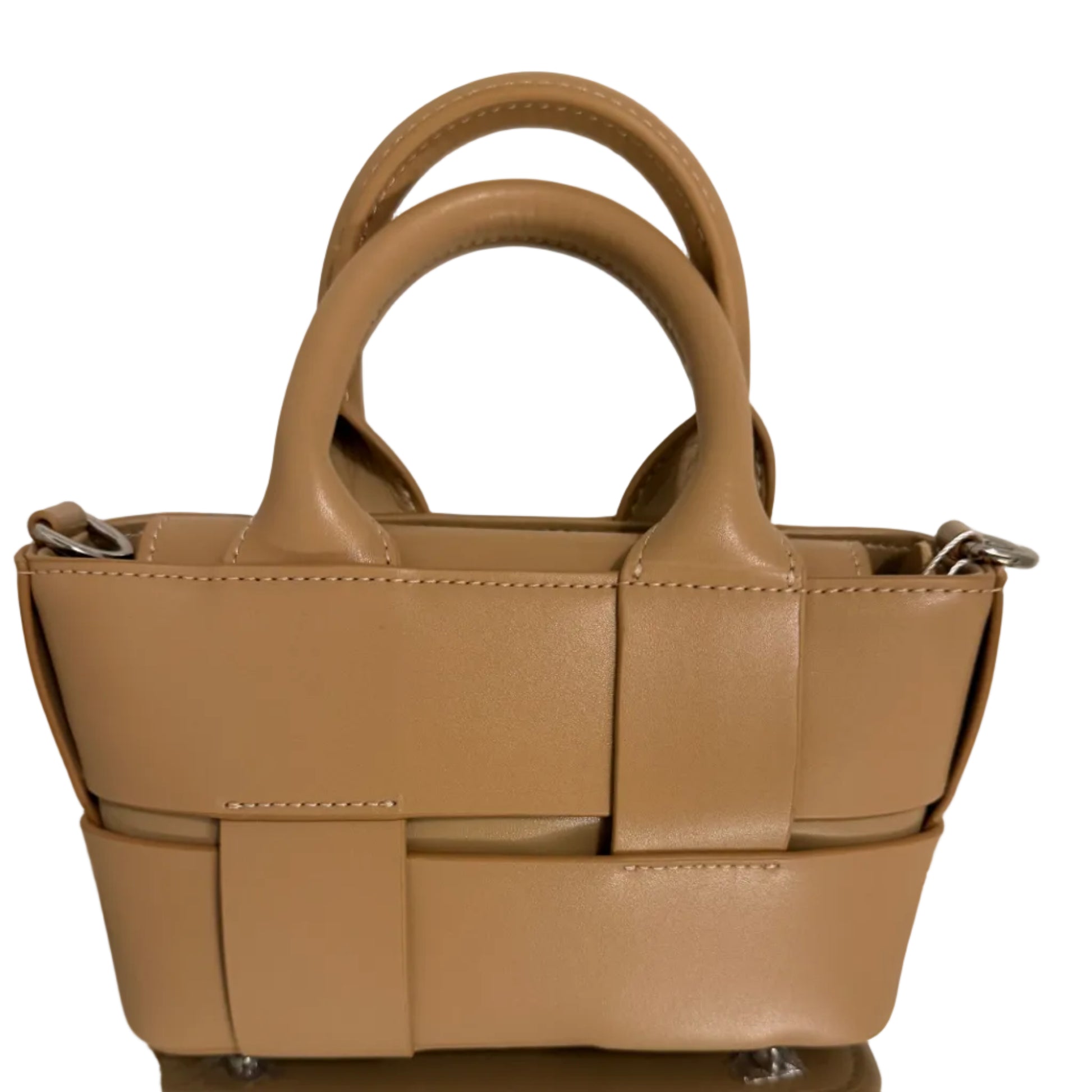 Beige handbag with woven design on a light background