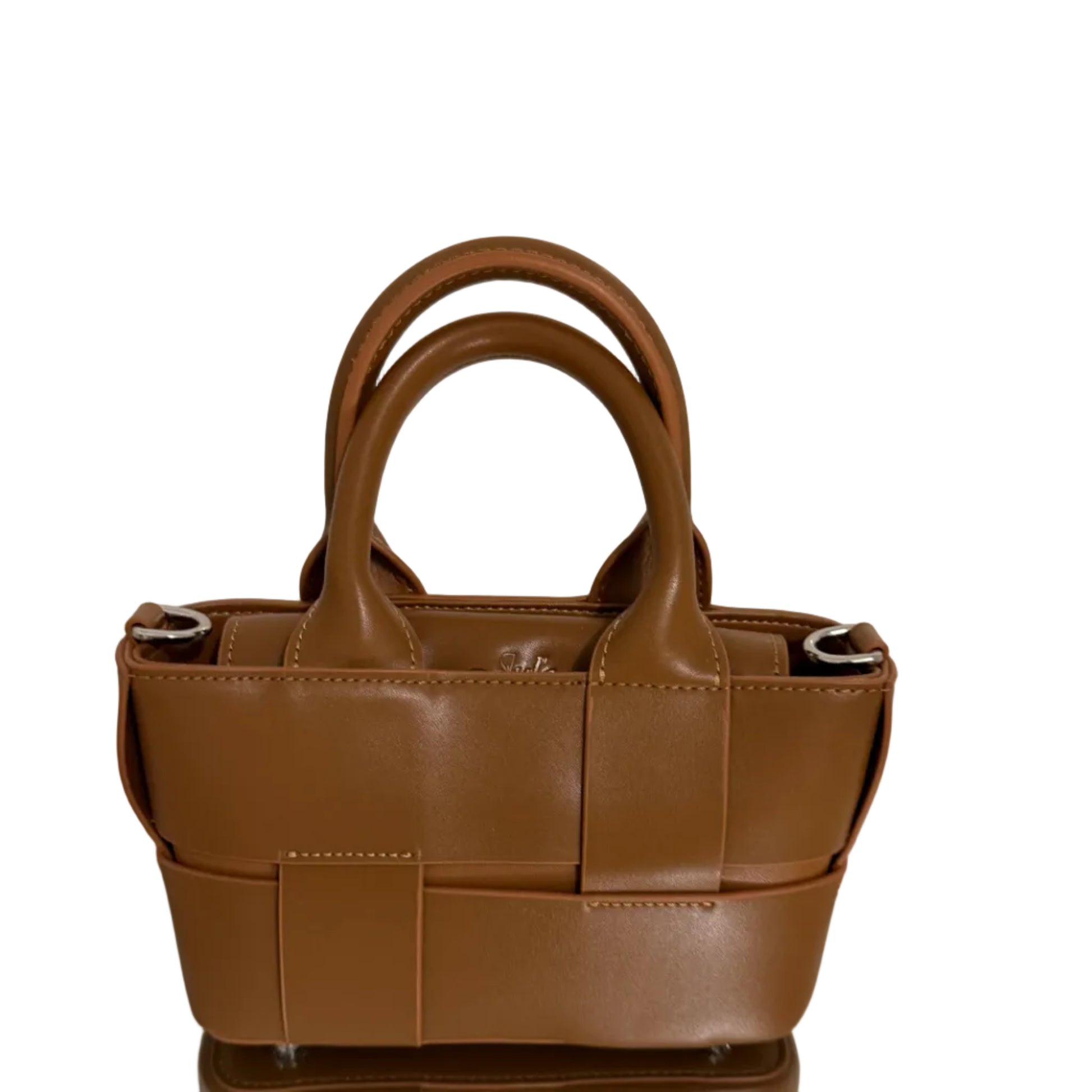 Brown leather handbag with woven pattern on a white surface