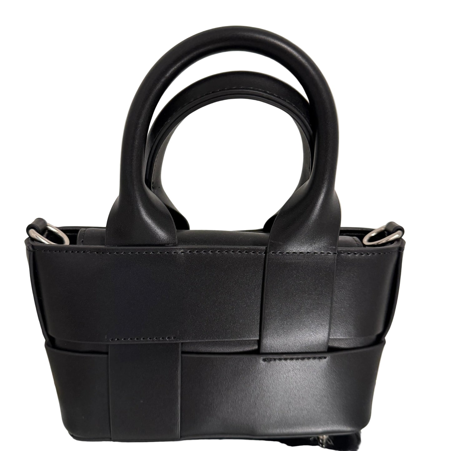 Black leather handbag with a unique handle design on a light background