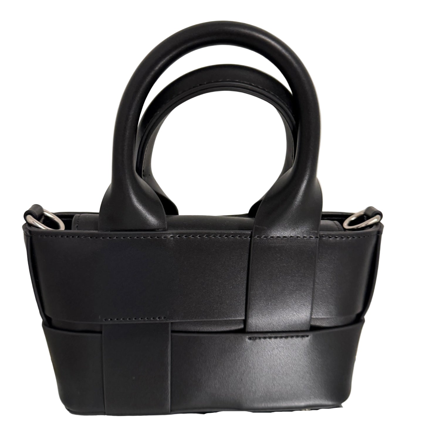 Black leather handbag with a unique design on a light beige background