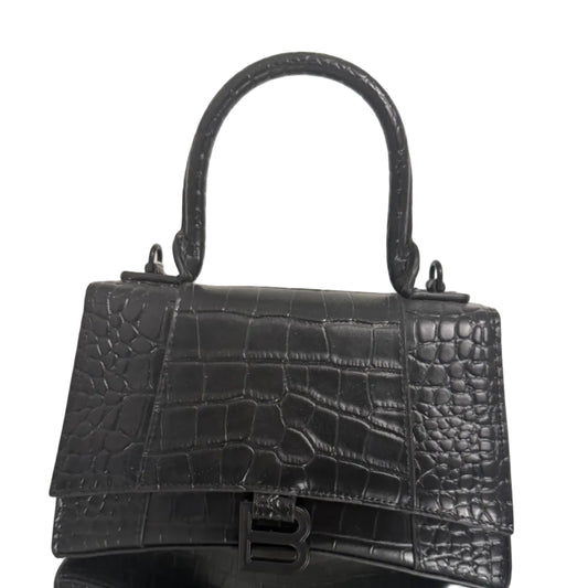 Black crocodile-patterned handbag on a light background