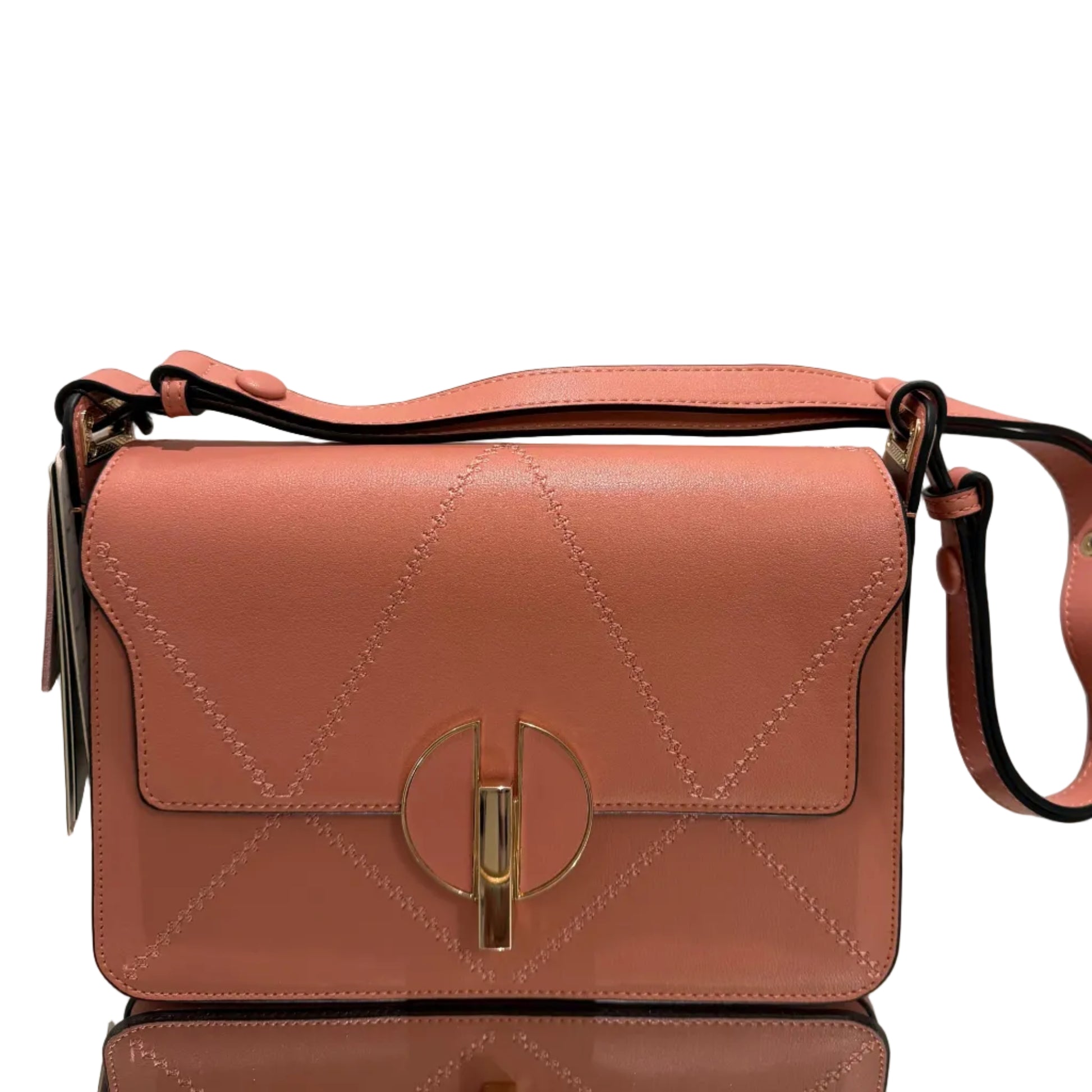 Pink handbag with a strap on a light gray background