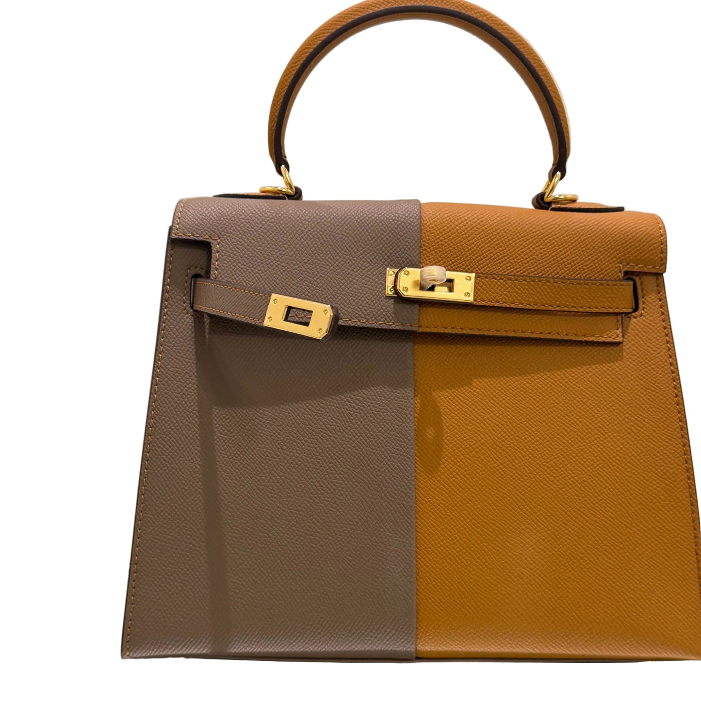 Two brown and gray handbags with gold hardware on a light background