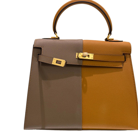 Two brown and gray handbags with gold hardware on a light background