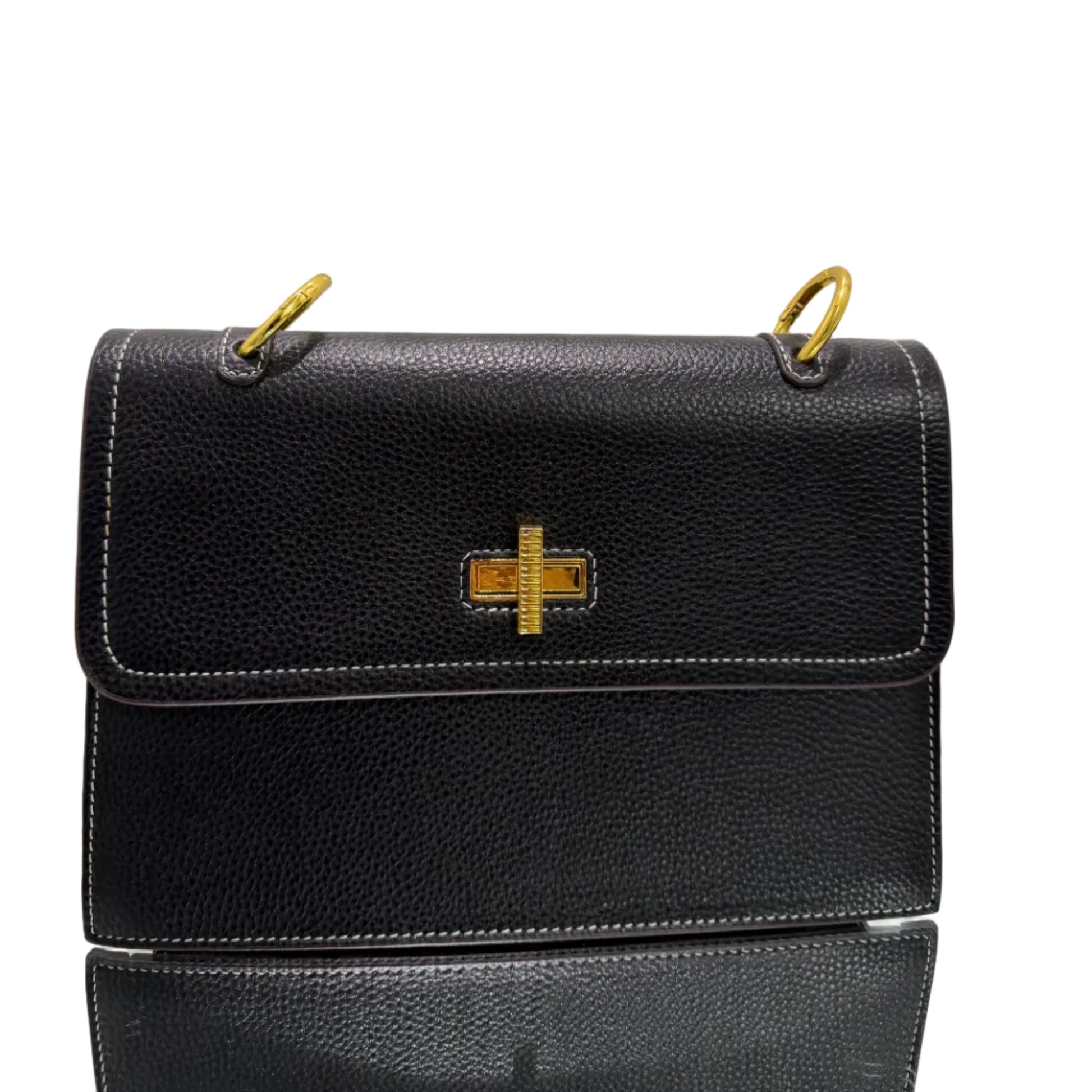 Black leather handbag with gold accents on a light gray background