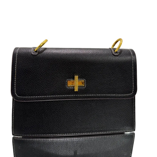 Black leather handbag with gold accents on a light gray background