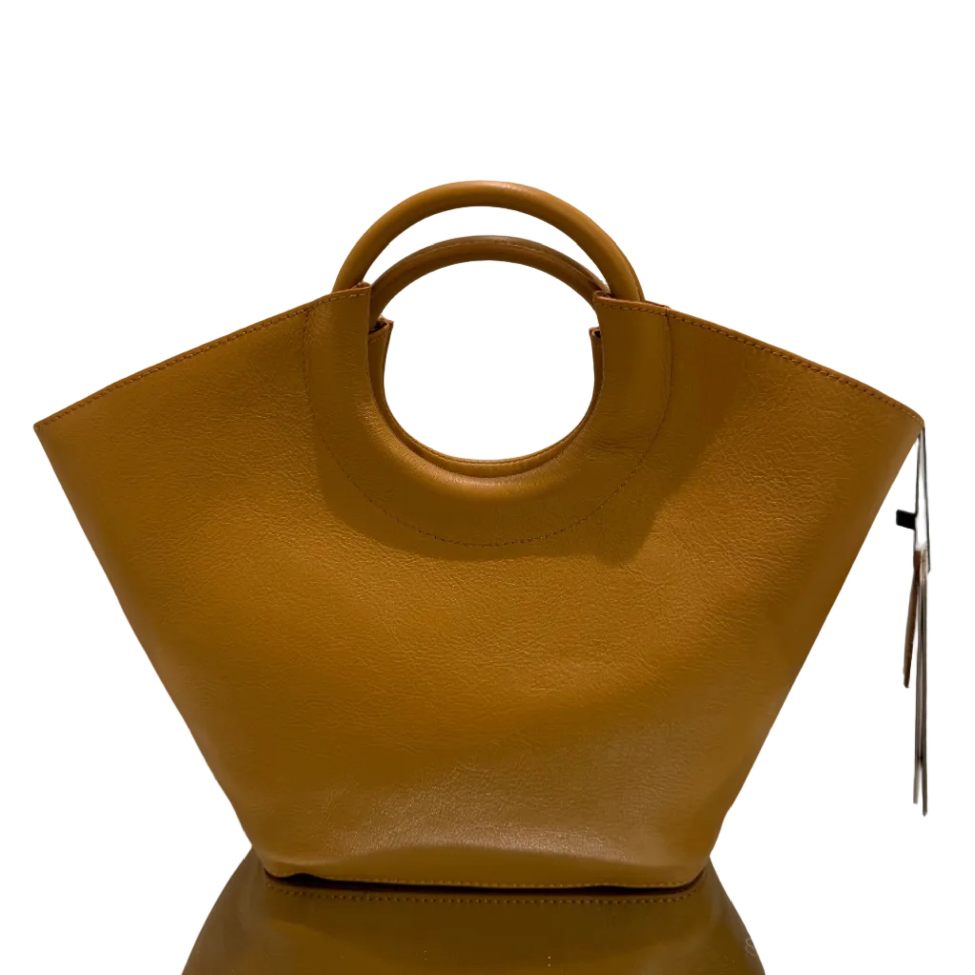 Brown handbag with circular handle on a white background