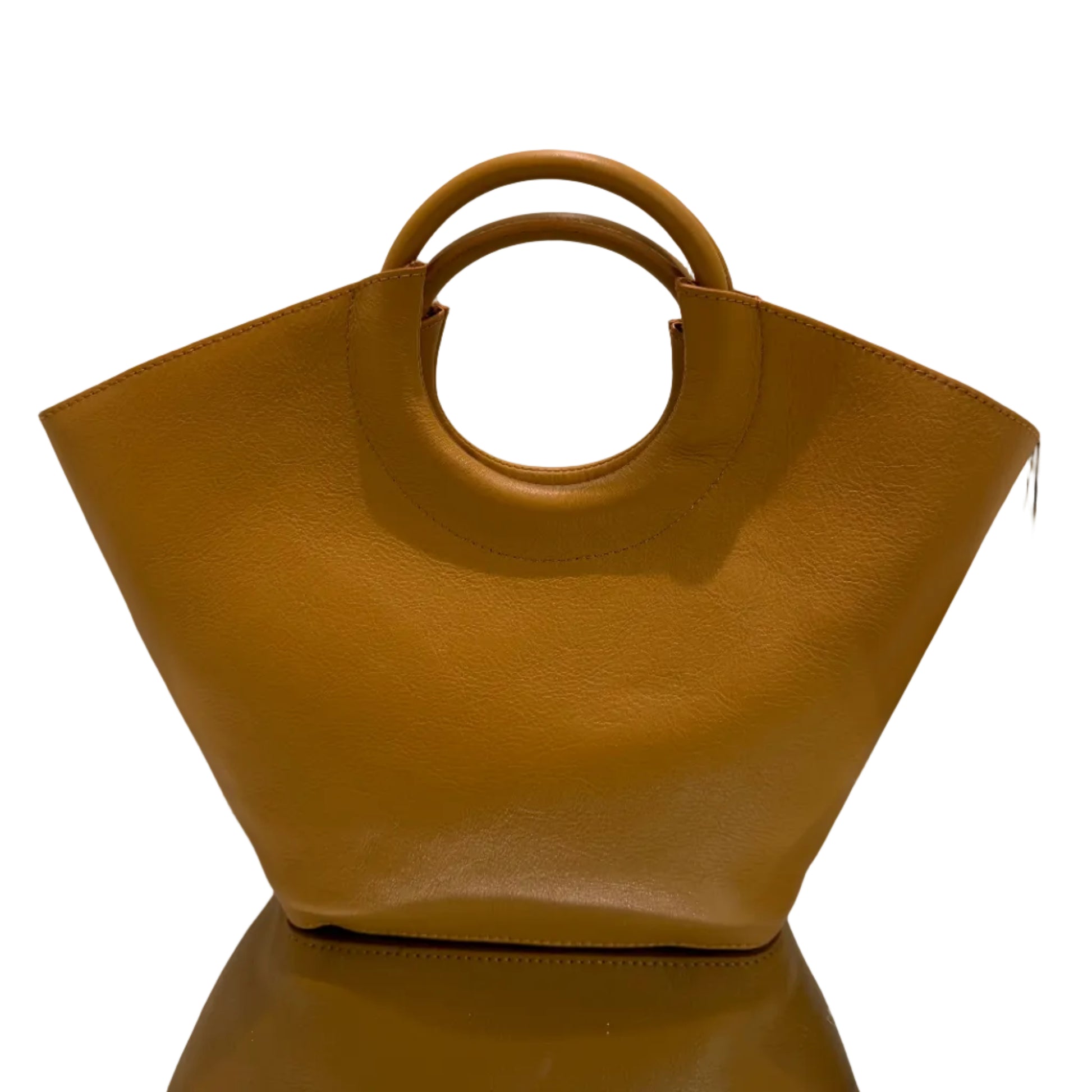 Brown handbag with circular handle on a white background