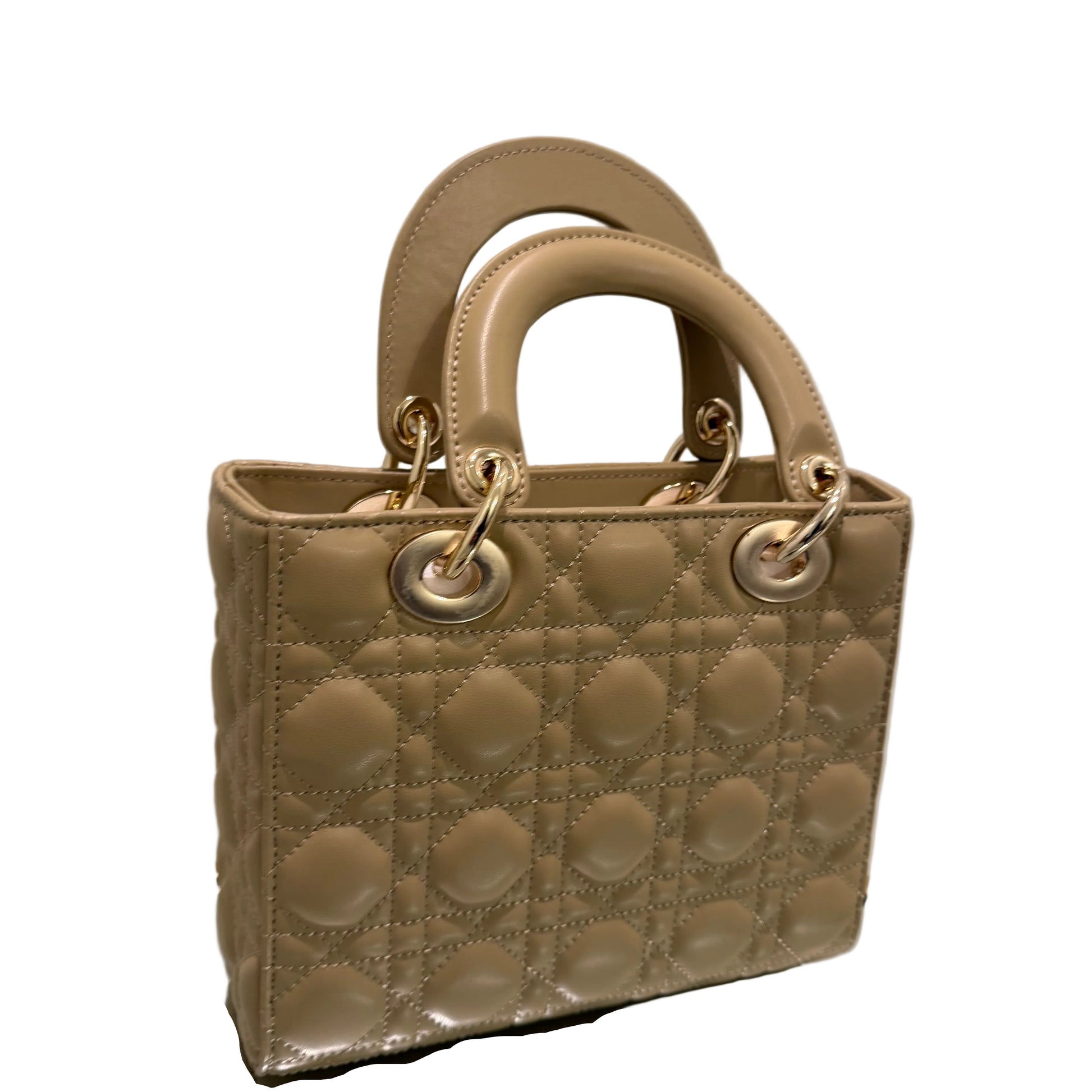 Beige quilted handbag with gold hardware on a light background