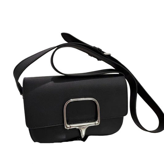 Black handbag with silver buckle on a white background