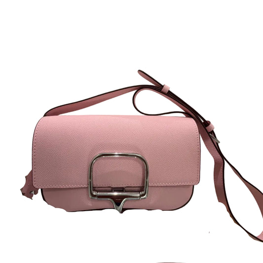 Pink handbag with a silver buckle on a light gray background