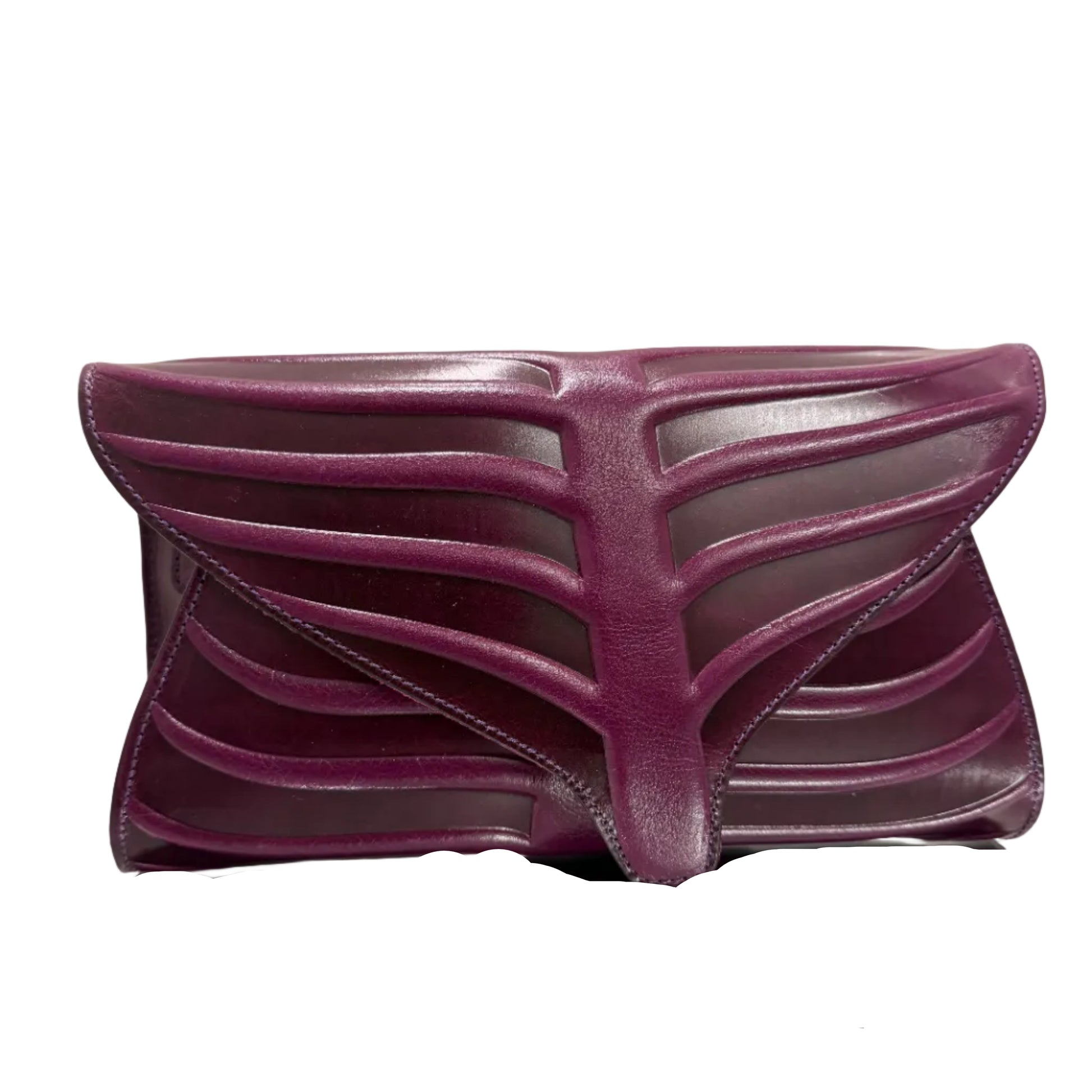 Purple shoe with a unique design on a beige background