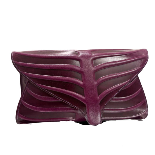 Purple shoe with a unique design on a beige background