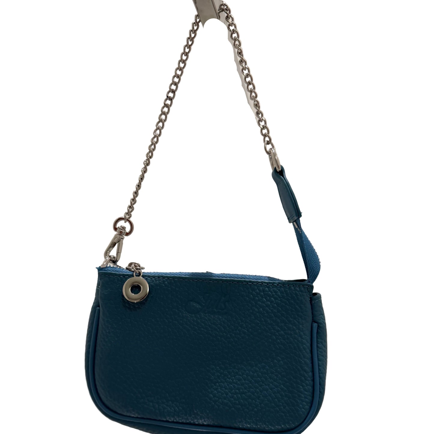 Blue handbag with a chain strap on a white surface