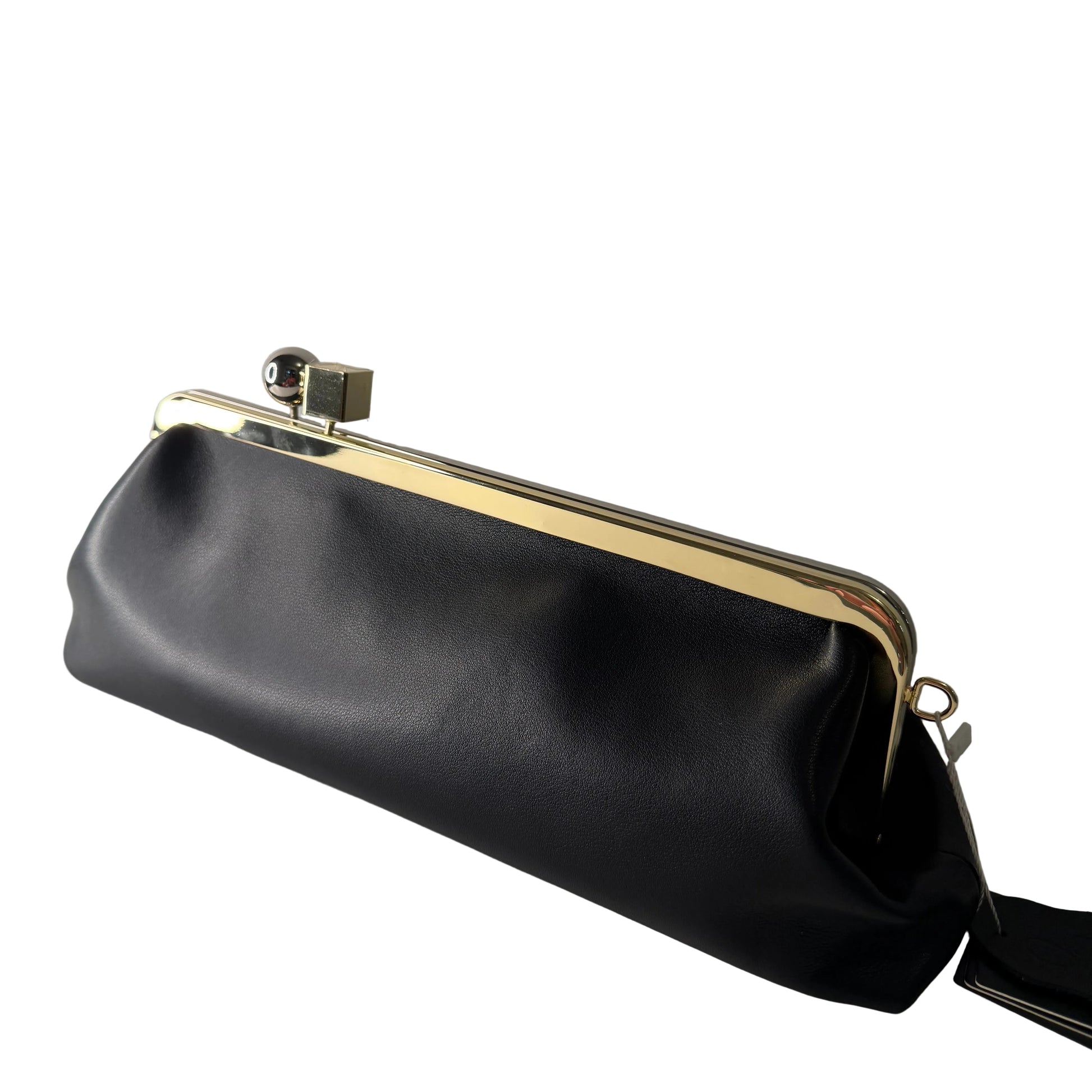 Black handbag with gold clasp on a light gray background