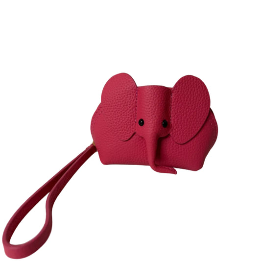 Red dog toy with a handle on a white background