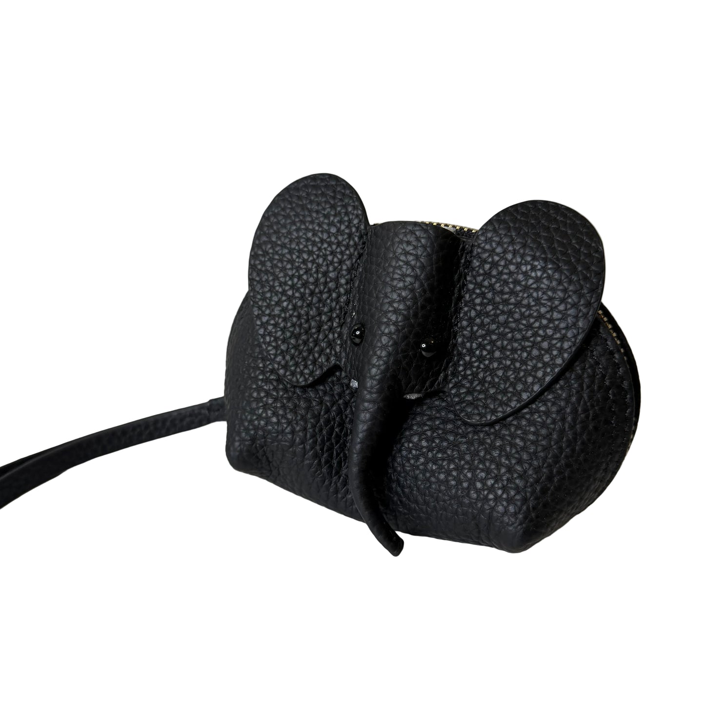 Black textured object attached to a white surface